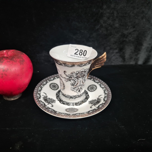 280 - A fabulous ornate porcelain demitasse cup and saucer in the Versace design by Rosenthal. Boasting gi... 