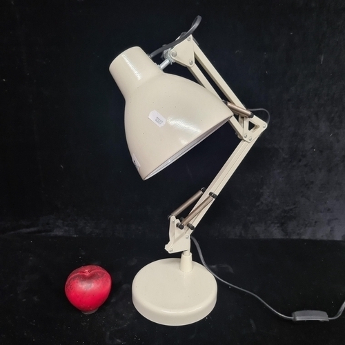 267 - An as new robust cream-colored Anglepoise desk lamp, ideal for any modern workspace or study area.