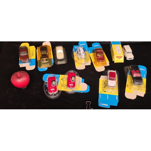 322 - 10 Corgi and Solido die-cast model cars including Corvette and Triumph examples. Sealed in original ... 