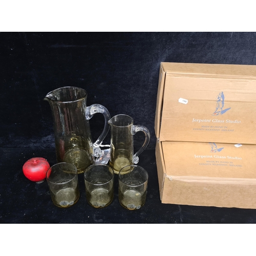 328 - A timeless Jerpoint Glass Studio drinks set, handcrafted in Kilkenny, Ireland. Includes two water pi... 