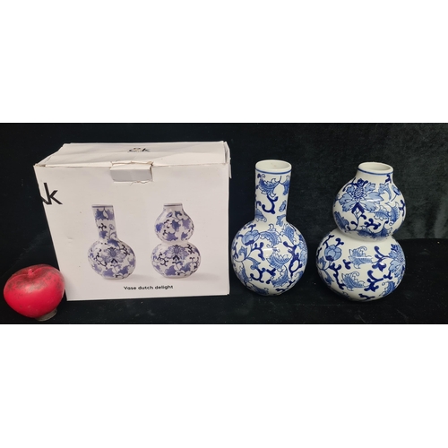 354 - Elegant blue and white porcelain vases, featuring traditional floral motifs, complete with original ... 