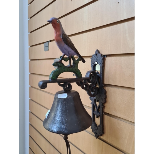 360 - A charming heavy cast metal wall bell featuring a sweet song bird finial to top. Fitted to wall with... 