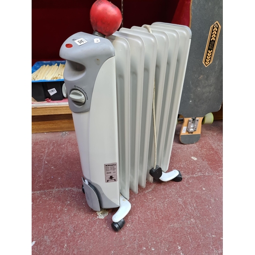 382 - Robust Dimplex portable electric heater, model OFC1507, featuring rolling casters for easy movement.... 