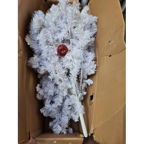 385 - A vibrant white artificial Christmas tree, nestled in original box, injecting festive cheer into any... 