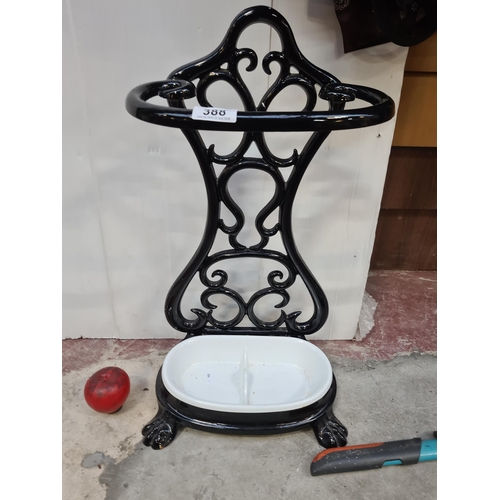 388 - Star Lot : An intricate, Victorian-style heavy  cast iron umbrella stand, featuring scrolling detail... 