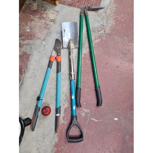 389 - Three useful garden tools including a shovel, lopping shears and long shears. Essential for the avid... 