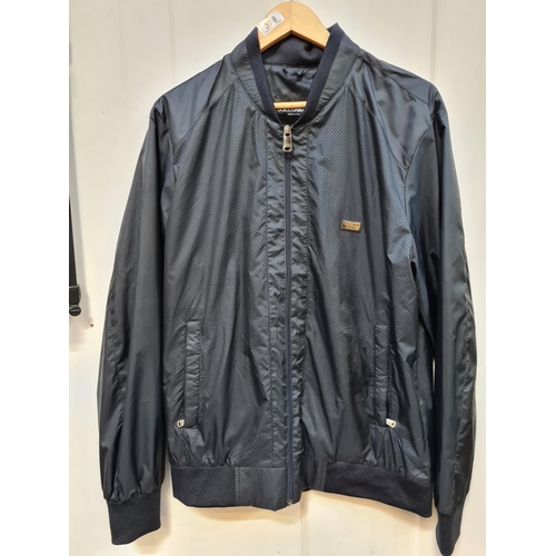 398 - A sleek Dolce & Gabbana designer bomber jacket in a minimalistic design, crafted from a breathable m... 