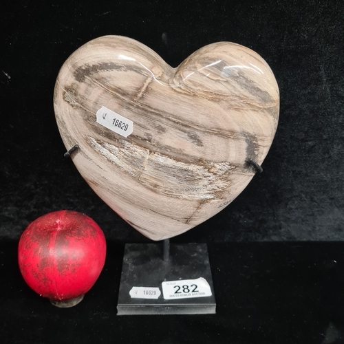 282 - A fabulous marble heart sculpture, showcasing natural patterns and serene form. Includes stand.