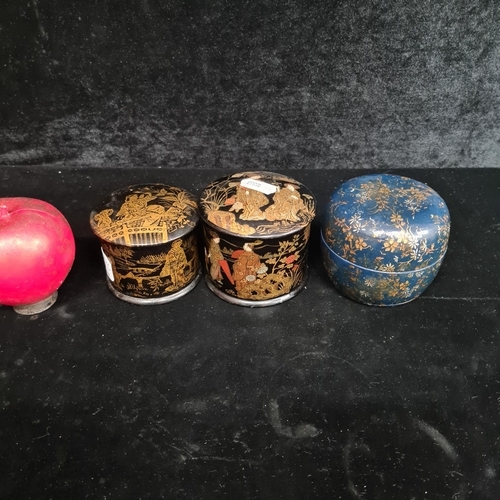 285 - A trio of oriental hand-painted lacquer boxes, featuring traditional designs with lustrous finish an... 