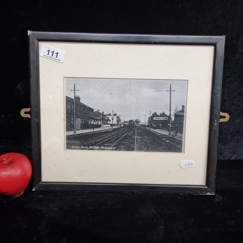 111 - A vintage print of the Cross Guns Bridge Phibsboro, Dublin. Housed in a black frame behind glass.