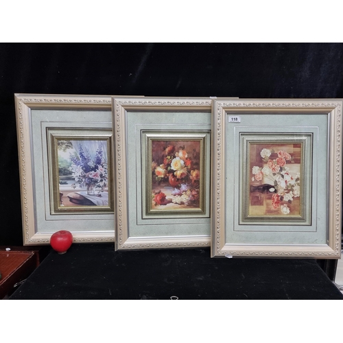 118 - A trio of vintage prints of still life paintings. Housed in painted silver gilt frames behind glass.