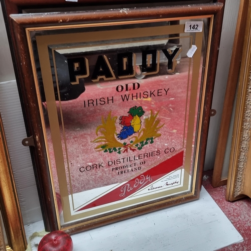 142 - A pub / bar mirror advertising Paddy's old Irish whiskey. Housed in a wood and gilt frame.