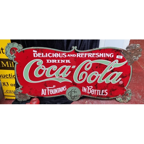 151 - A large metal sign showing a vintage advertisement for Coca-Cola.