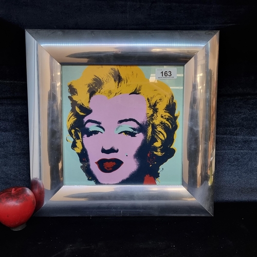 163 - A digital print of the iconic Marylyn Monroe by Andy Warhol housed in a stylish chrome frame.