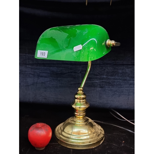 193 - A handsome banker's lamp with a green glass shade and brass base.