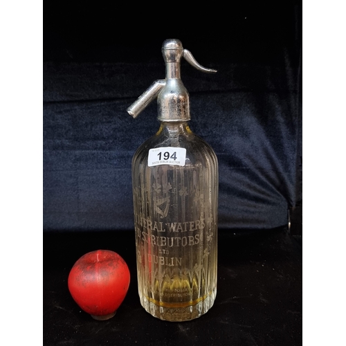 194 - A vintage Irish flying harp syphon bottle from Mineral Waters Distributors Ltd. Dublin. Featuring or... 