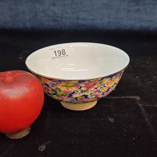 198 - A beautiful Chinese Qianlong style bowl boasting a vibrant tactile floral design to exterior and int... 