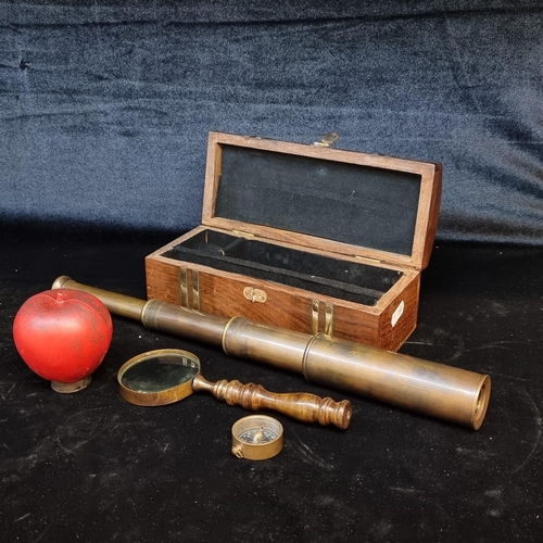 199 - A handsome desk top set comprising of a three-draw telescope with good optics, a magnifying glass an... 