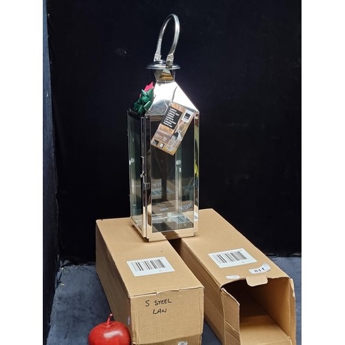 955 - Two brand new in box tall stainless steal lanterns. These items are all new from a maker in the west... 