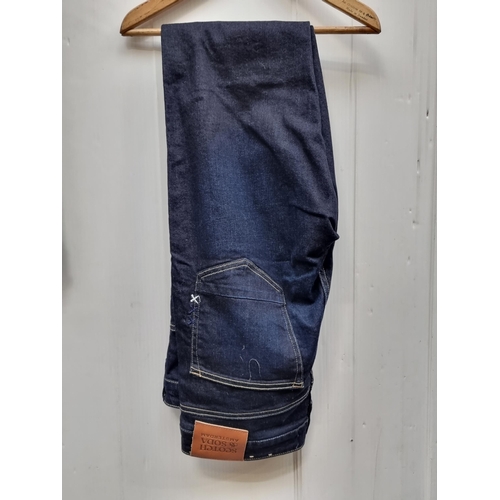 414 - A pair of dark denim Scotch & Soda Amsterdam 'Skim' jeans with unusual cross-stitch detailing to bac... 