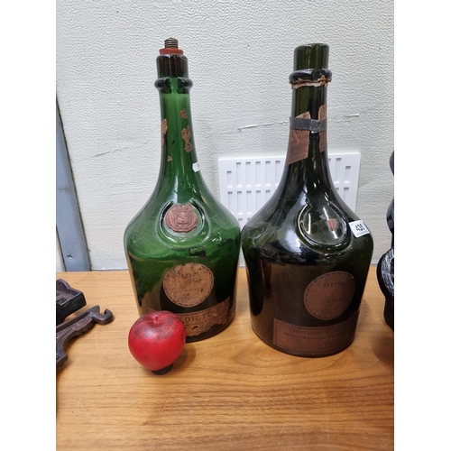 435 - Two fabulous large glass French Bénédictine liqueur bottles.