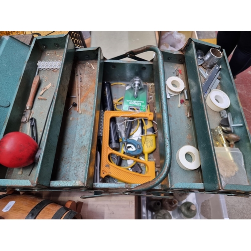 446 - A vintage metal cantilever tool box containing a selection of tools and DIY accessories.