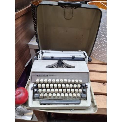 449 - A vintage Gabriele 25 typewriter housed in a hard shell travel case.