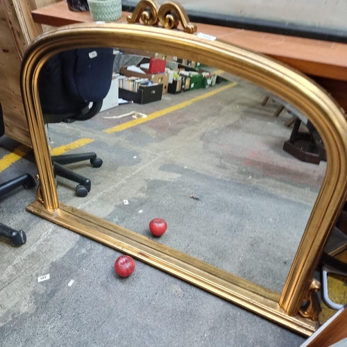 465 - Star Lot : A large contemporary beveled over mantle mirror housed in a gilt gold frame. H85cm x W117... 