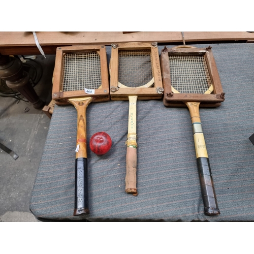 468 - Three vintage tennis rackets including an Elverys and Clerys example, with wood protectors.