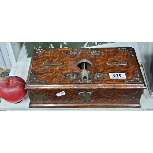 679 - A very sophisticated antique oak cigar and cigarette box with appropriate labels, compartments under... 