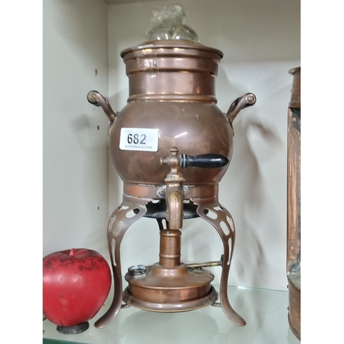 682 - A charming Art Nouveau USA made copper samovar with a tripod base holding a burner, wooden handles a... 