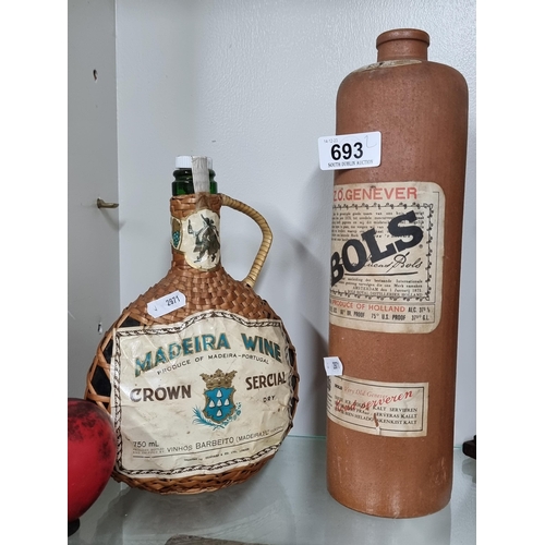 693 - Two vintage bottles including a ceramic 1L Bols Z.O. Genever example c. 1970s and a full 75cl Crown ... 