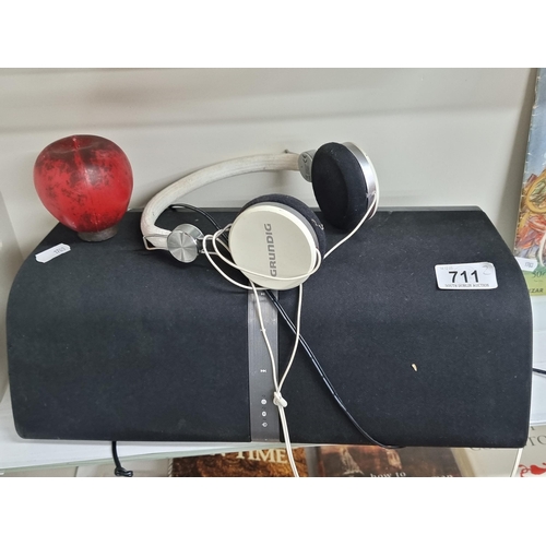 711 - A high quality Blaupunkt portable speaker along with a pair of Grundig headphones.