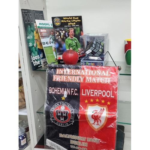 720 - Five items of football interest including early 2000s Irish football programmes, a brand new Celtic ... 