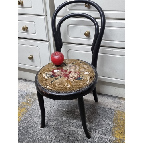 726 - An exquisite Childs circa 1920 J&J Kohn, Thonet-style bentwood chair, featuring original needlepoint... 