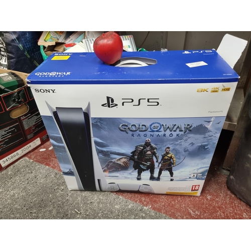 740 - For Spares or repair. A Sony PlayStation 5 gaming console with God of War: Ragnarok game bundle. In ... 