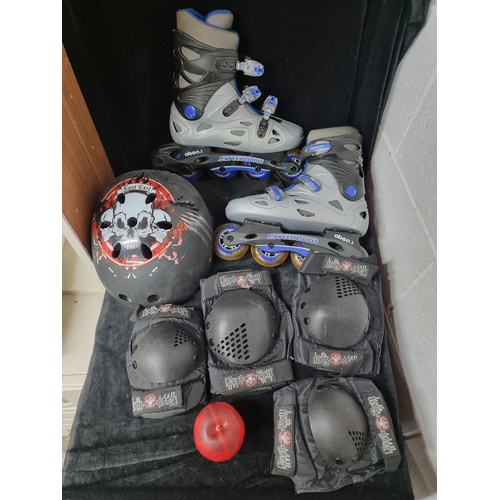 747 - A pair of high quality rollerblades UK size 6, along with a protective helmet, knee and shoulder pad... 