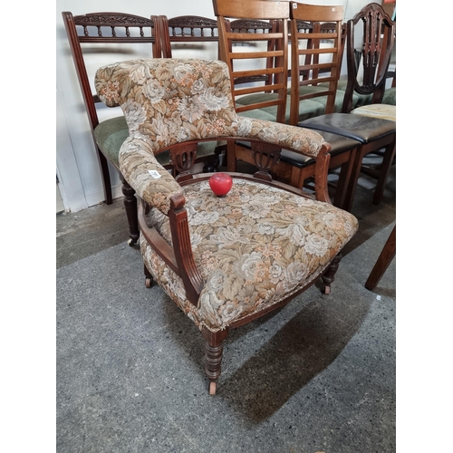 791 - A stunning Victorian walnut tub chair beautifully upholstered in a floral pattern.