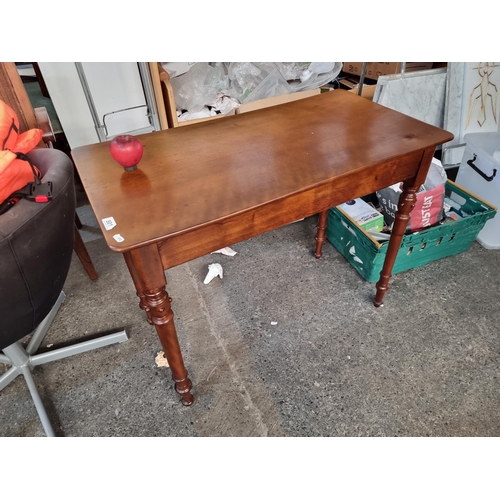 801 - A beautiful Victorian  console table with lovely turned legs. There is a small split in the wood on ... 