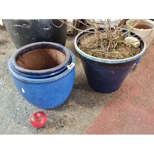 803 - Three pretty terracotta planters in a navy glaze.