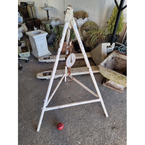 809 - An antique Salter's weighing scale with hook to weigh up to 100lbs. Held on a metal tripod frame. H1... 