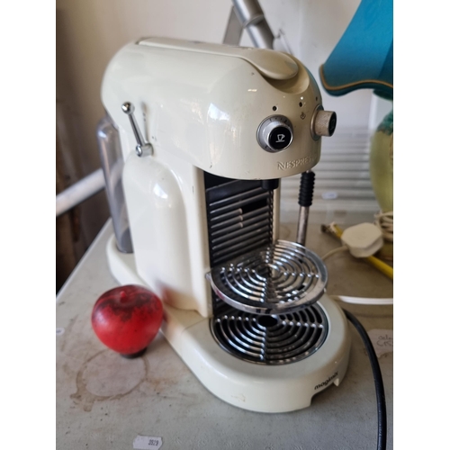 811 - A heavy cast metal  Nespresso capsule coffee machine by Magimix. With water container, milk frother ... 