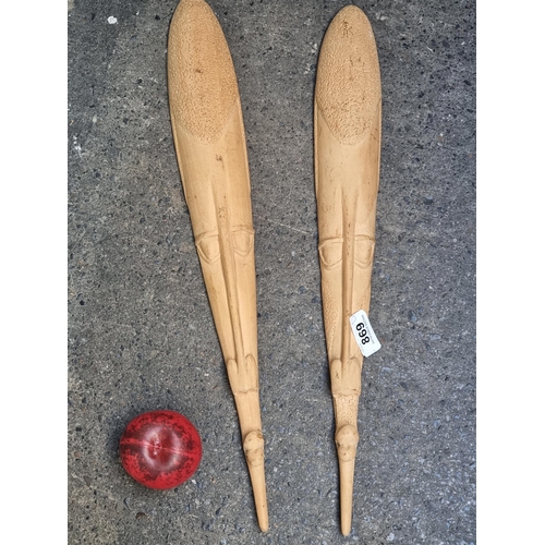 869 - Two large long hand carved wooden African tribal masks. Look to have good age.