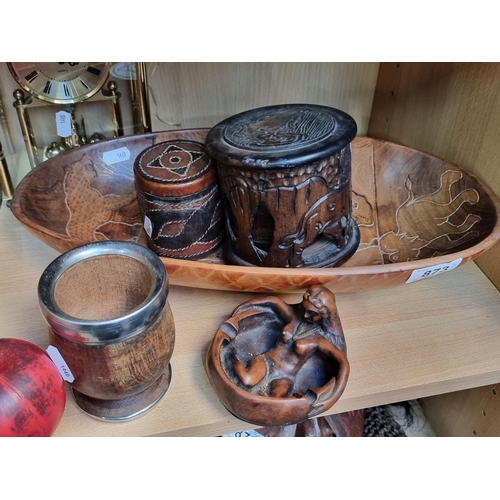 873 - An assortment of hand carved wooden items including a set of coasters in a carved case bosting eleph... 