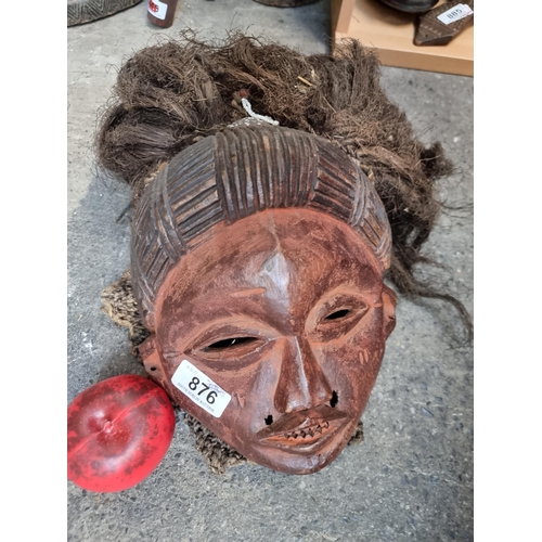 876 - Star Lot: An outstanding antique tribal example of Pwo, a classic Chokwe mask genre that honors foun... 