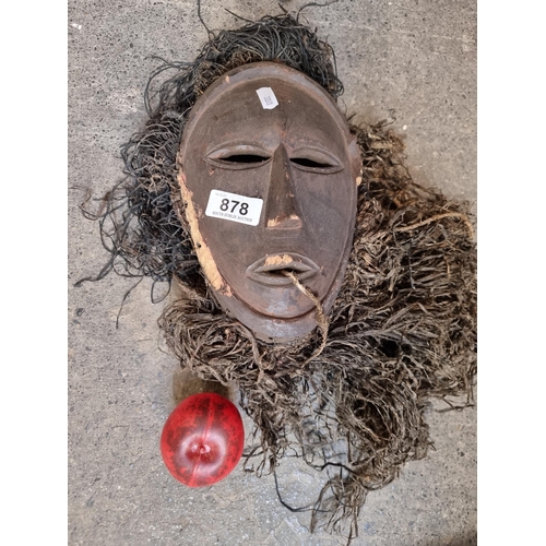 878 - Star lot: An antique tribal Lega Bwami mask featuring a simple, abstract shape of face with almond s... 