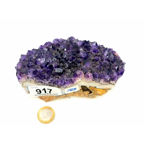 917 - A block of natural bright purple amethyst gemstone, weight 734 grams. Retail price of €140