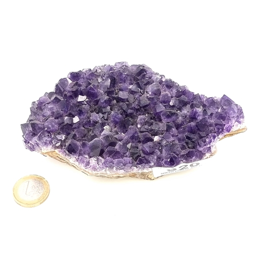 920 - A block of natural bright purple amethyst stones, weight 630 grams.