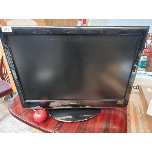 975 - A Hannspree full HD 1080 P LCD TV model no. Smart TV  HSG1115, with a 23 1/2 