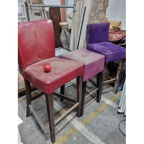 640 - Three commercial bar stools in red and purple leather and a purple velvet with brass stud work. Need... 